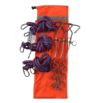 Camping tent guy line kit with blue braided cords and metal stakes on an orange pouch.